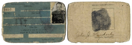 Nuremberg Book Signed by 18 Nazi War Criminals During the WWII Nuremberg Trials -- Includes Signatures by Goring, Donitz, Streicher & Speer, and Also Two ID Cards by U.S. Guard Who Acquired Signatures